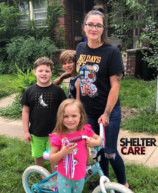 Woman with three children and a bike