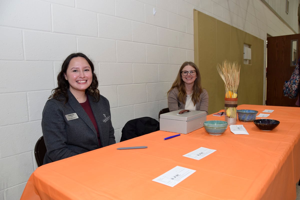 Volunteers sitting at a table at the 815 Hunger Luncheon